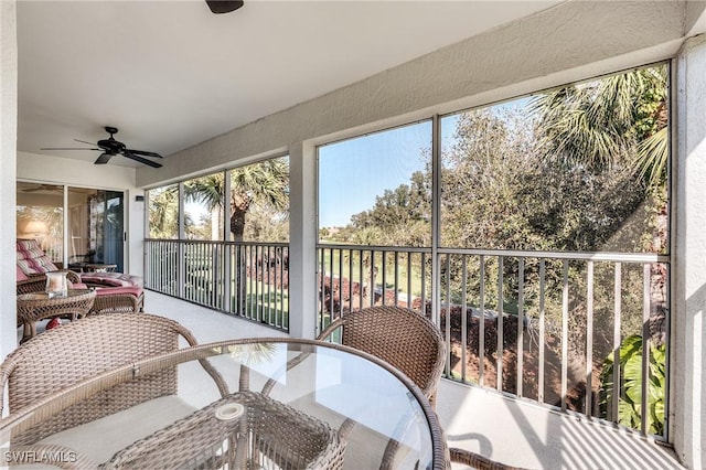 sunroom with a ceiling fan