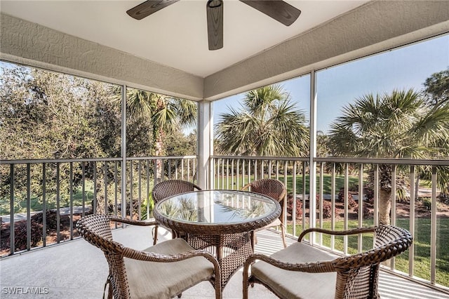 sunroom featuring plenty of natural light and a ceiling fan