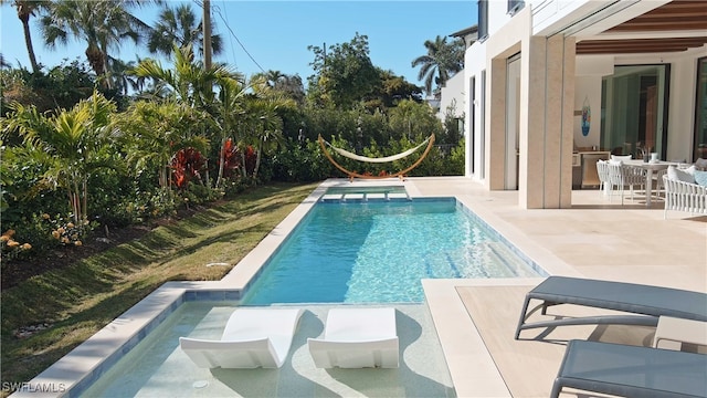 view of swimming pool featuring a patio area