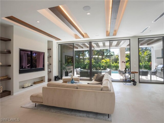 living area featuring floor to ceiling windows, a sunroom, and built in features