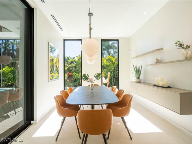 dining space featuring expansive windows