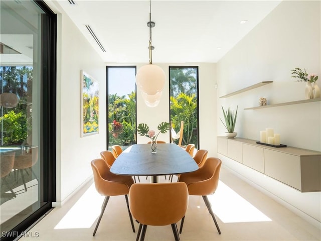 dining room with visible vents and floor to ceiling windows