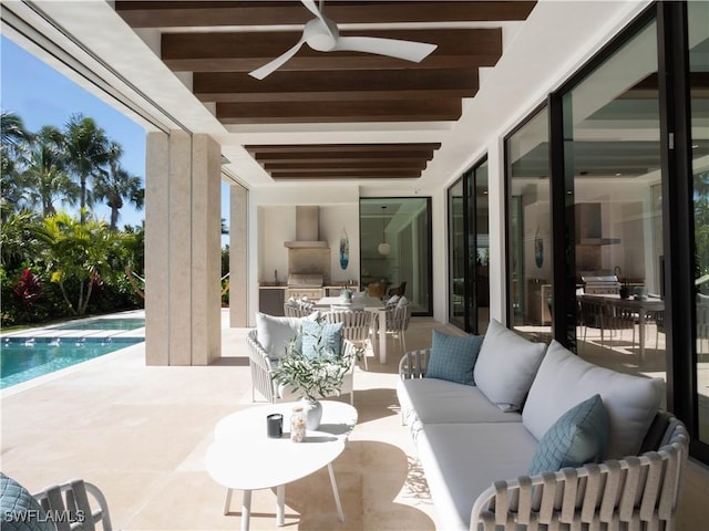 view of patio / terrace featuring area for grilling, an outdoor kitchen, an outdoor hangout area, and ceiling fan