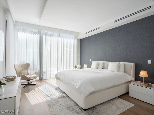 bedroom featuring wood finished floors