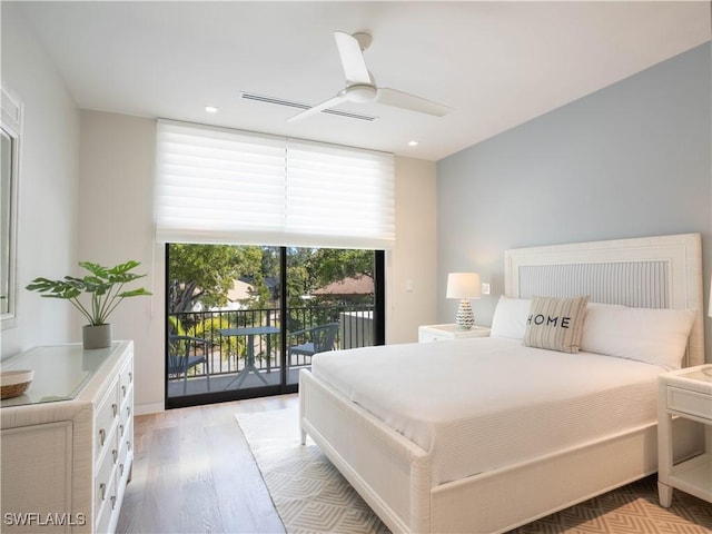 bedroom with ceiling fan, light hardwood / wood-style flooring, and access to outside