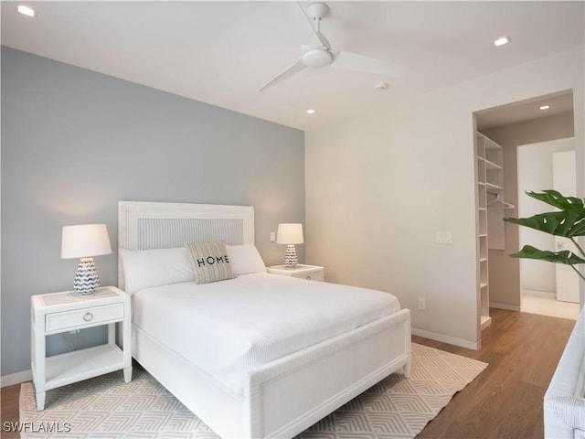 bedroom featuring ceiling fan and light hardwood / wood-style flooring