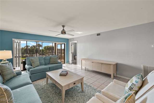 living room with light tile patterned flooring and ceiling fan