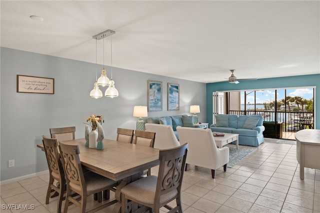 dining room featuring light tile patterned flooring and ceiling fan