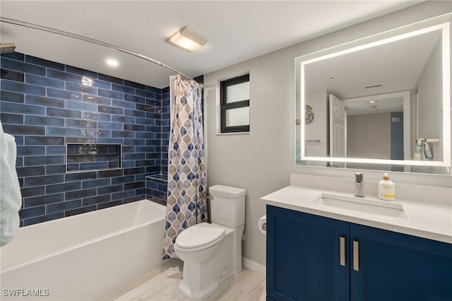 full bathroom with shower / bathtub combination with curtain, vanity, and toilet