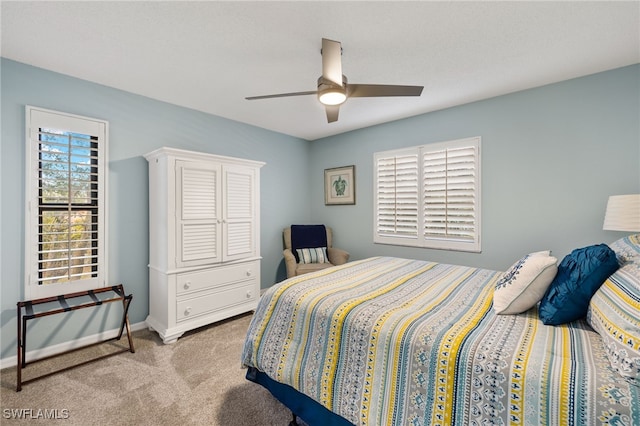 carpeted bedroom featuring ceiling fan