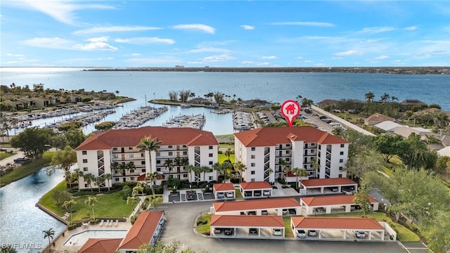 birds eye view of property with a water view