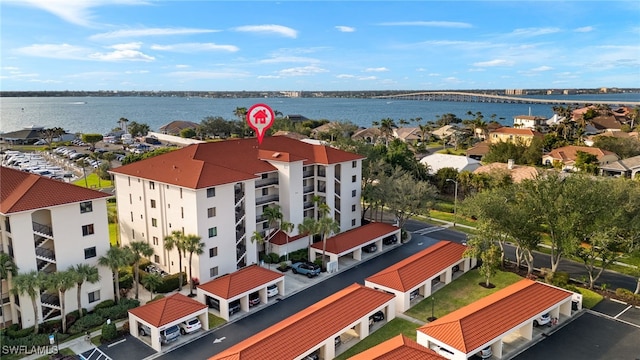 birds eye view of property featuring a water view