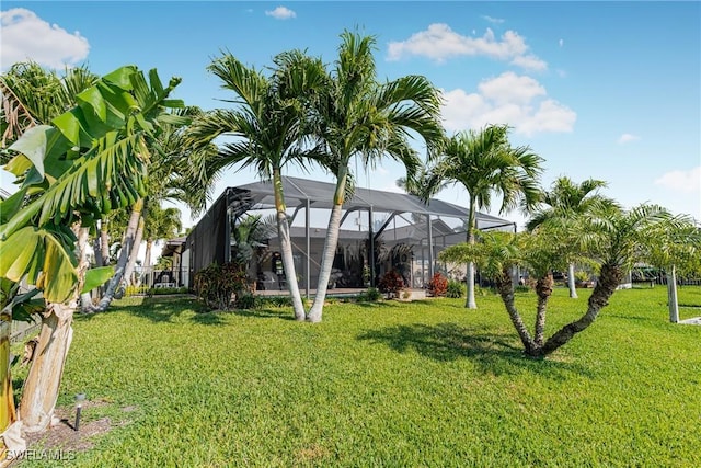 view of yard with glass enclosure