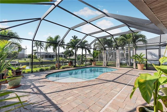 view of swimming pool with a patio area and glass enclosure