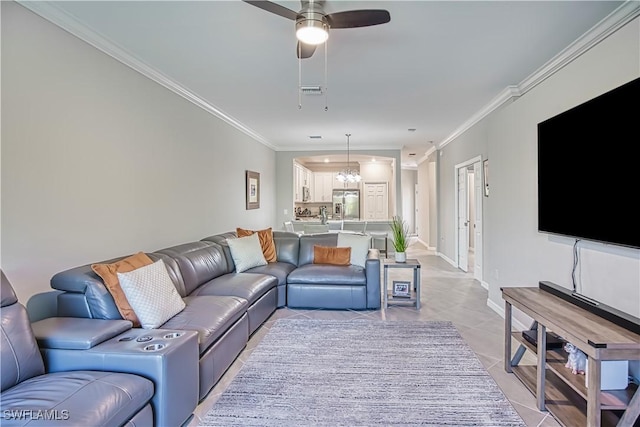 living room with a ceiling fan, baseboards, crown molding, and light tile patterned flooring