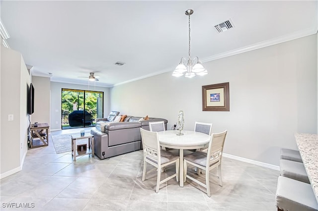 dining area with ceiling fan with notable chandelier, ornamental molding, visible vents, and baseboards