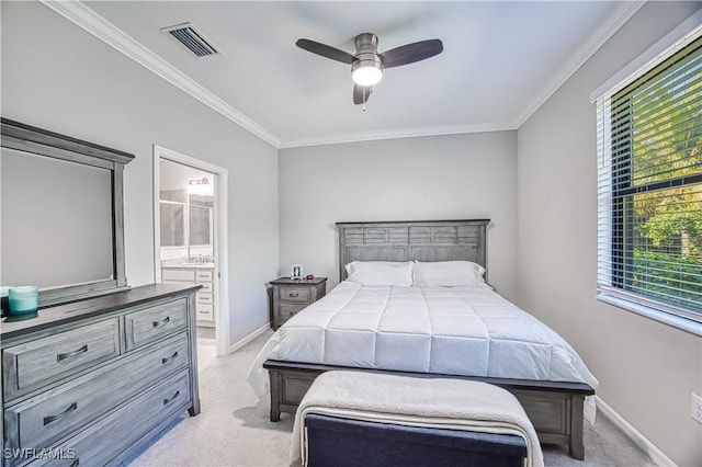 bedroom with visible vents, ensuite bathroom, crown molding, and light colored carpet