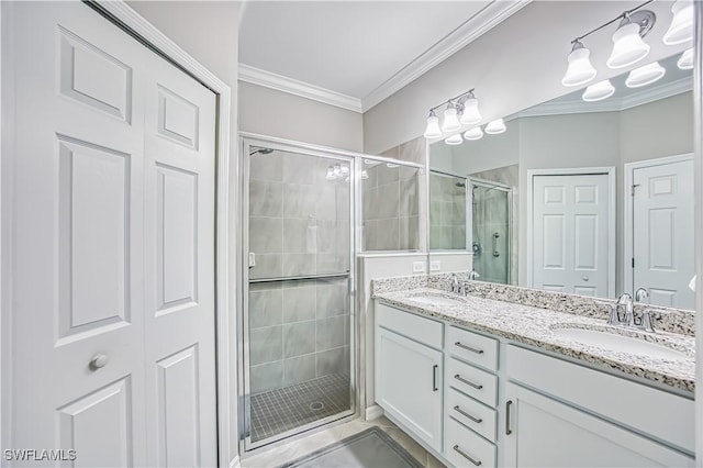 full bathroom with a sink, a stall shower, ornamental molding, and a closet