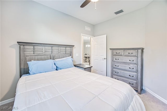 carpeted bedroom with ceiling fan, visible vents, and baseboards