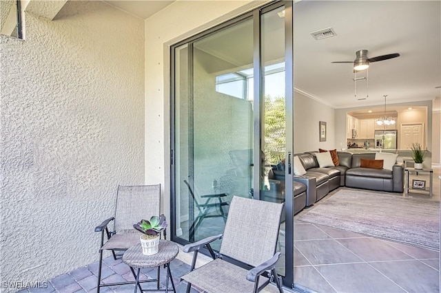 view of patio featuring ceiling fan, visible vents, and an outdoor hangout area