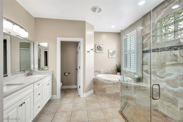 full bathroom with vanity, tile patterned floors, plus walk in shower, and toilet