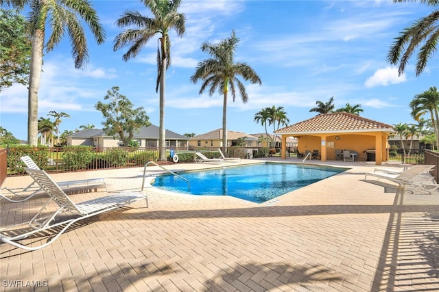 view of swimming pool with a patio area