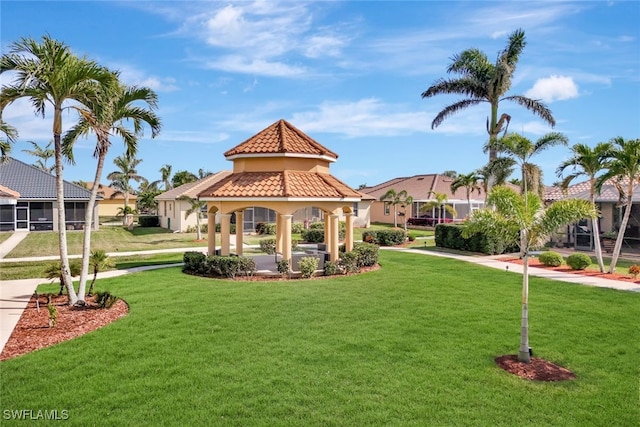 view of property's community with a gazebo and a lawn