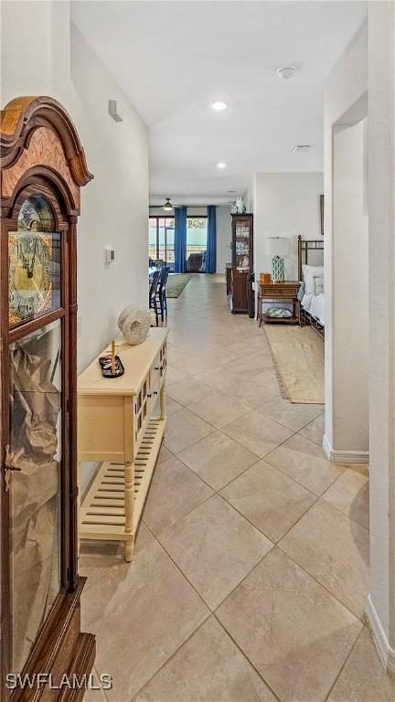 corridor featuring light tile patterned flooring