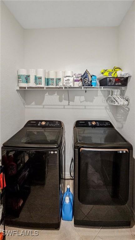 clothes washing area featuring washing machine and dryer