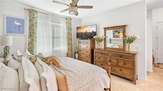 bedroom featuring light tile patterned floors and ceiling fan