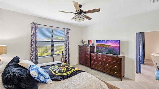 bedroom featuring ceiling fan and light tile patterned floors