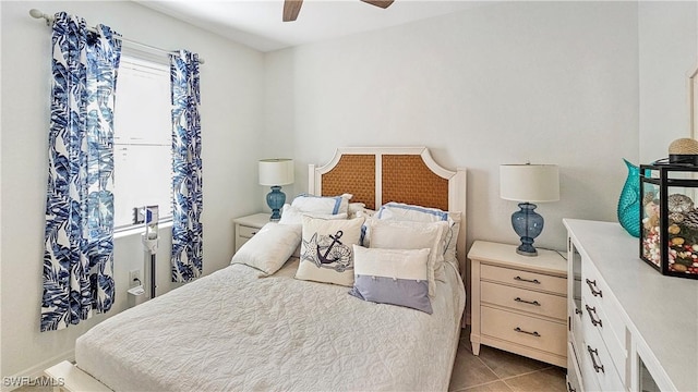 bedroom with light tile patterned flooring and ceiling fan