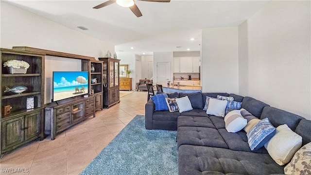 tiled living room with ceiling fan