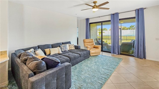 tiled living room featuring ceiling fan