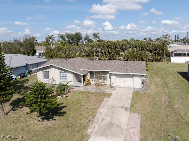 ranch-style home featuring a garage and a front lawn