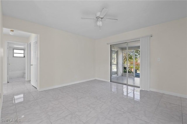 spare room with ceiling fan