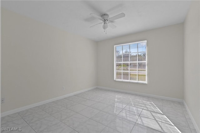 spare room with ceiling fan