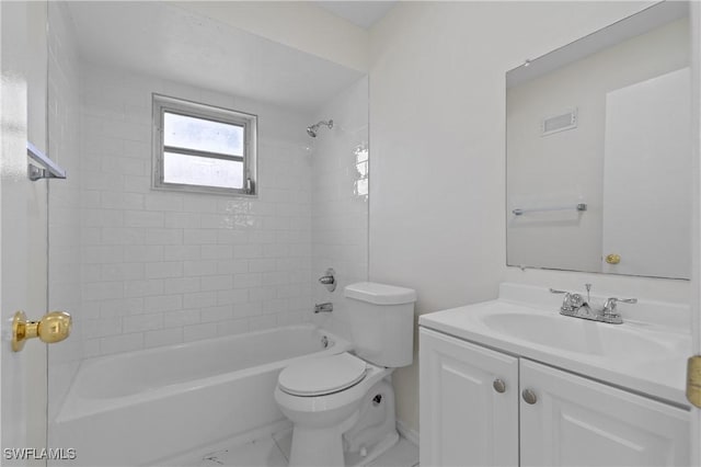 full bathroom featuring vanity, toilet, and tiled shower / bath