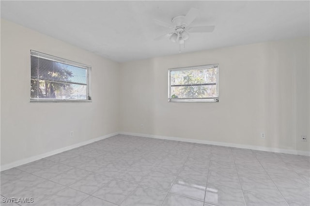 empty room with plenty of natural light and ceiling fan