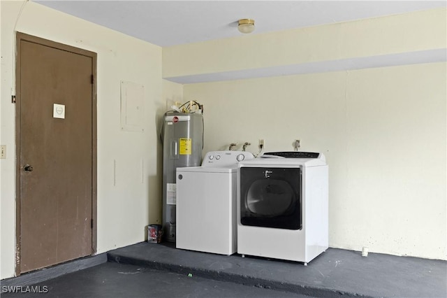 washroom featuring electric water heater and washer and dryer