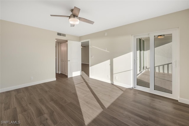7930 Estero Blvd, Fort Myers Beach, FL 33931 - spare room featuring baseboards, dark wood-style flooring, and ceiling fan