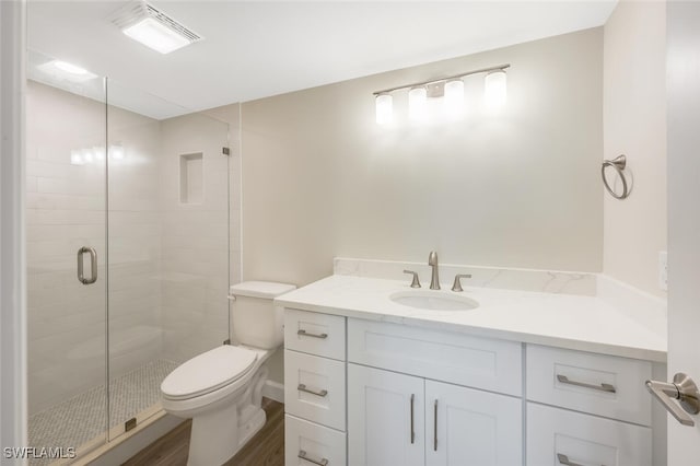 7930 Estero Blvd, Fort Myers Beach, FL 33931 - bathroom featuring vanity, a shower stall, toilet, and wood finished floors