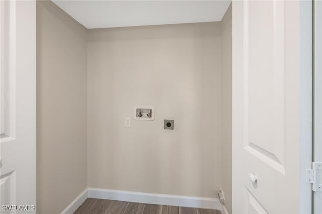 laundry room featuring hookup for a washing machine, hookup for an electric dryer, laundry area, dark wood-type flooring, and baseboards