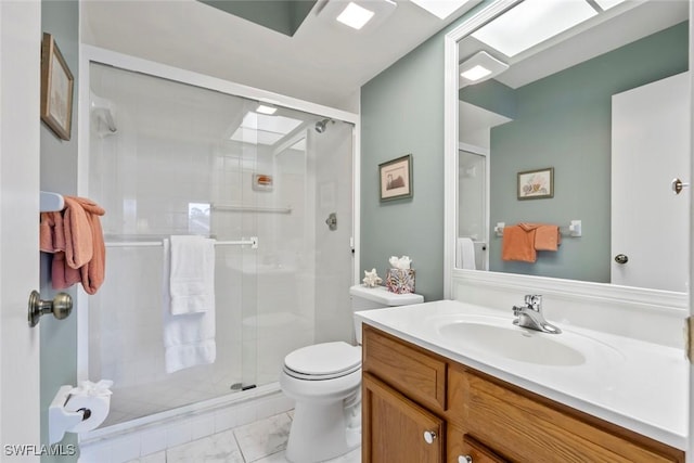 bathroom featuring vanity, toilet, and a shower with door