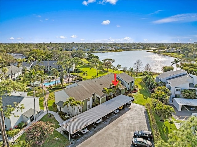 birds eye view of property with a water view