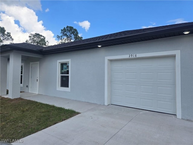 view of home's exterior featuring a garage and a lawn