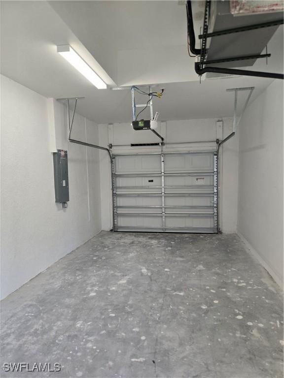 garage featuring a garage door opener and electric panel