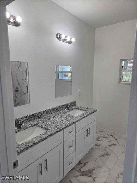 bathroom featuring vanity and plenty of natural light