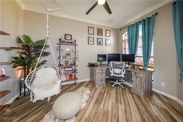 office space featuring crown molding, ceiling fan, and light wood-type flooring