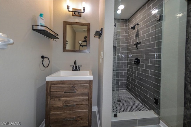 bathroom with walk in shower and vanity